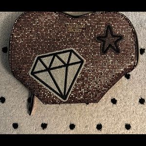 Victoria Secrets small cosmetic glitter bag.